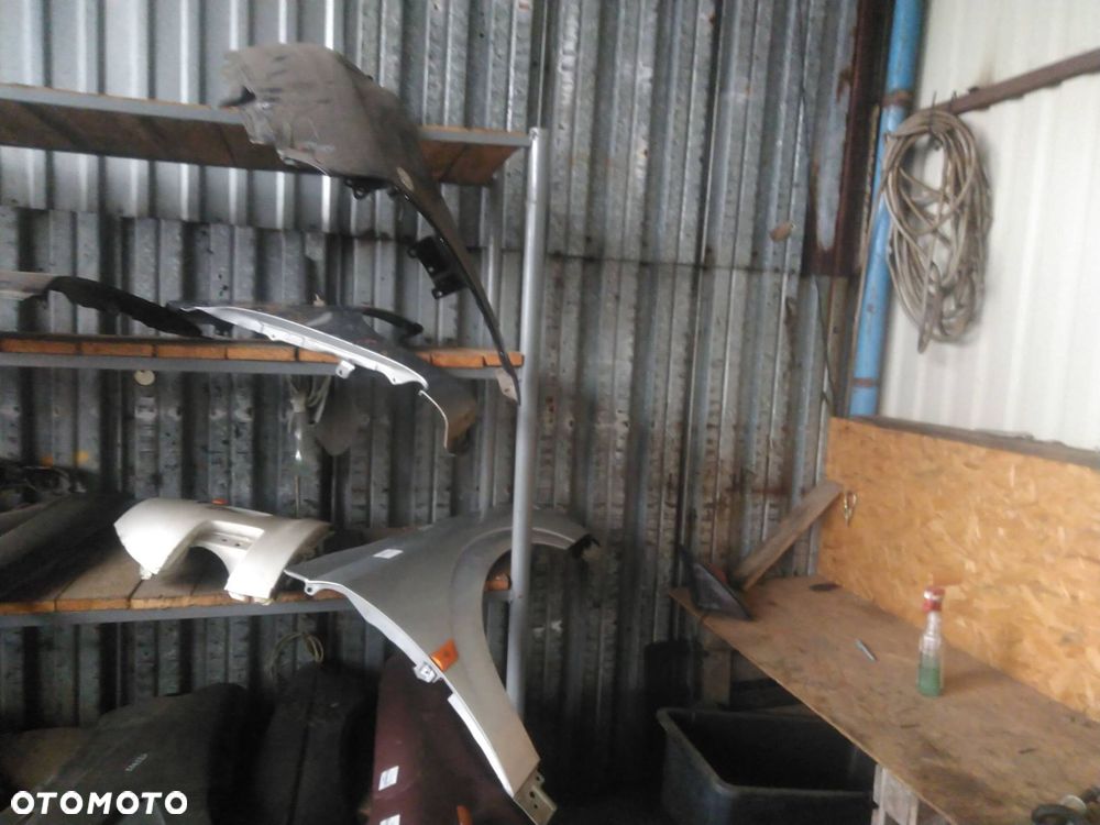 BŁOTNIK PRAWY PRZÓD TOYOTA YARIS II LIFT 1F8 - 6