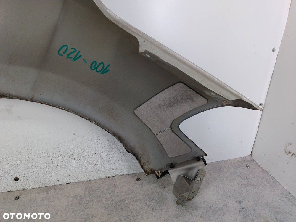 BŁOTNIK LEWY PRZÓD NISSAN TIIDA K32 - 13
