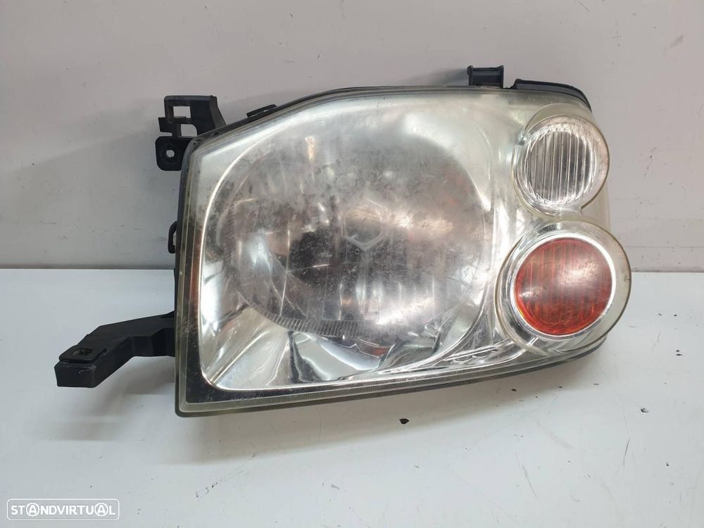 FAROL ESQUERDO NISSAN PICKUP D22 - 1