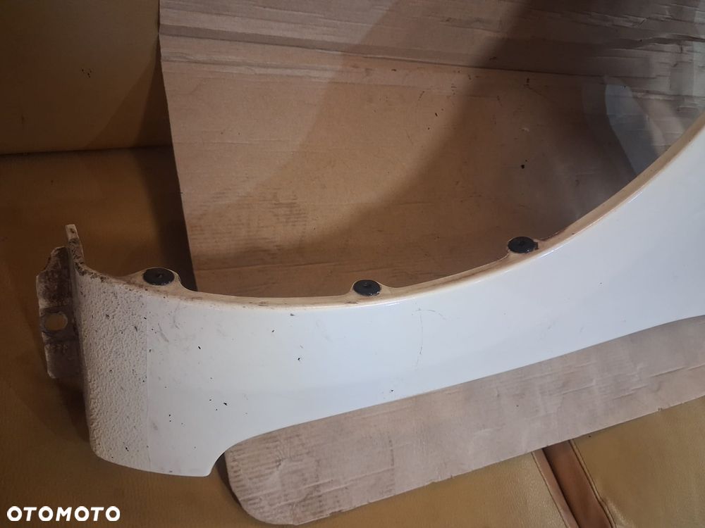 Błotnik KIA RIO III LIFT  lewy  biały kol UD - 4