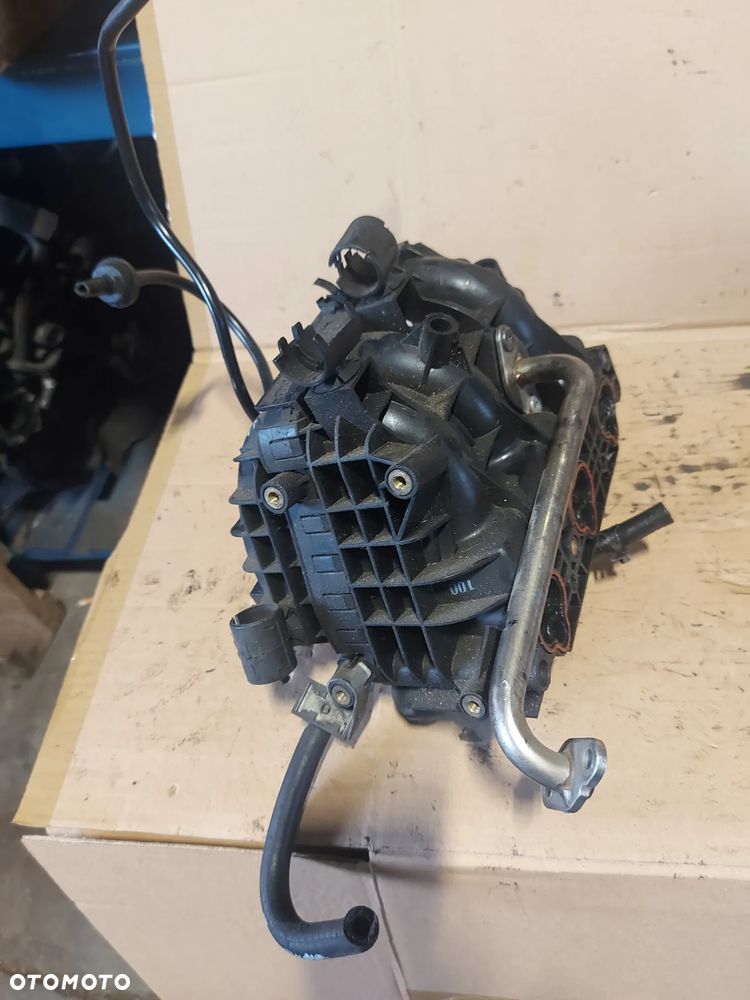 Kolektor ssący Opel Corsa C 1.0b '03r 09129713 - 4