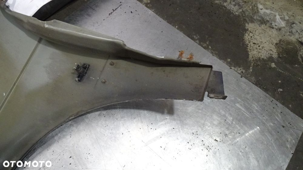 BŁOTNIK PRAWY PRZÓD SAAB 9-3 I 2.0 - 6