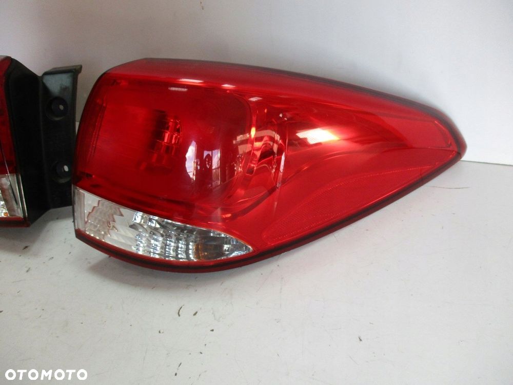 Lampa KIA CARENS 15r LEWA - 2