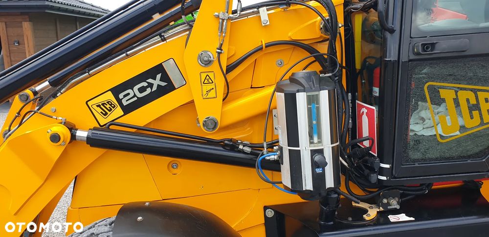 JCB 2CX tylko 2835mtg! z ROTOTILT / 3 łyżki /widły/centralne smarowanie/klimatyzacja / STAN IDEALNY !! - 21