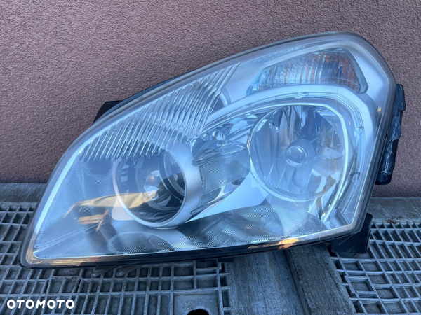 Lampa przednia NISSAN QASHQAI J10 XENON LEWY EUROPA ORYGINALNA HELLA