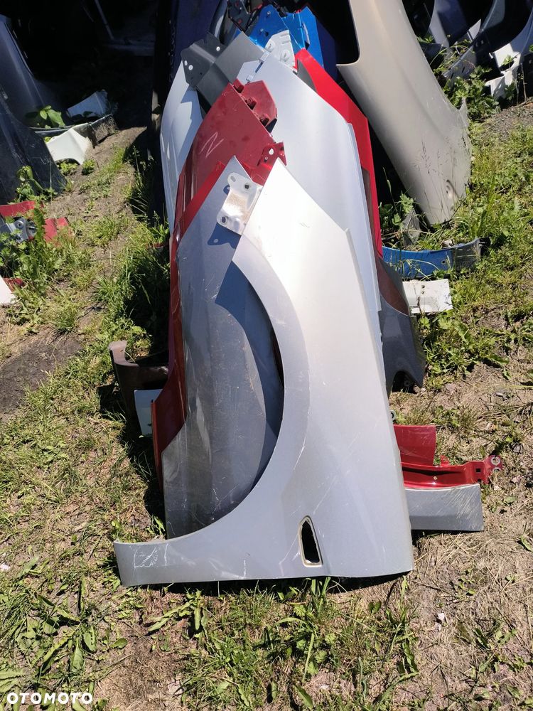 Błotnik przedni przód lewy Astra k - 1