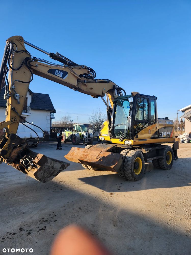 Caterpillar M313D - 11