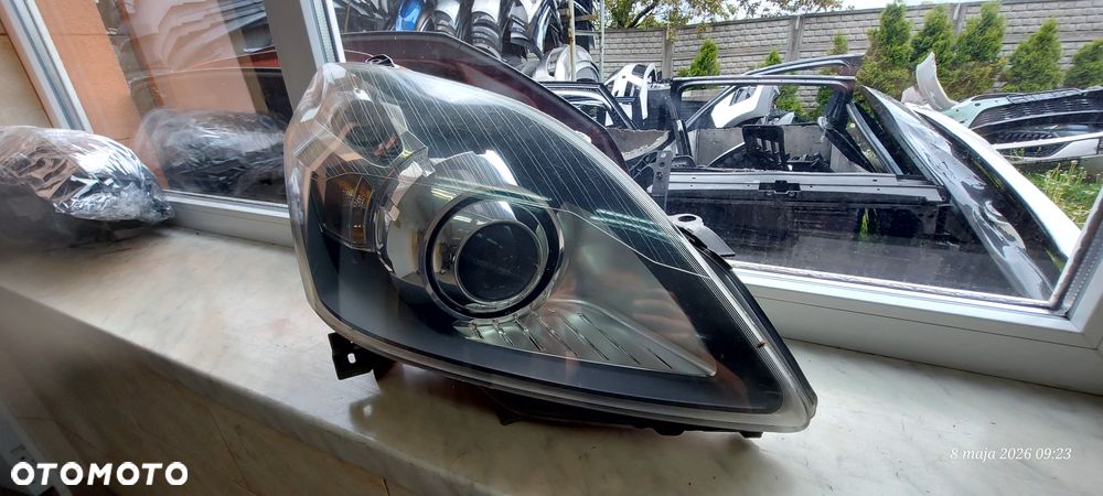 Opel Zafira B Reflektor Przód Przedni Prawy Bixenon Skrętny 13252471RH