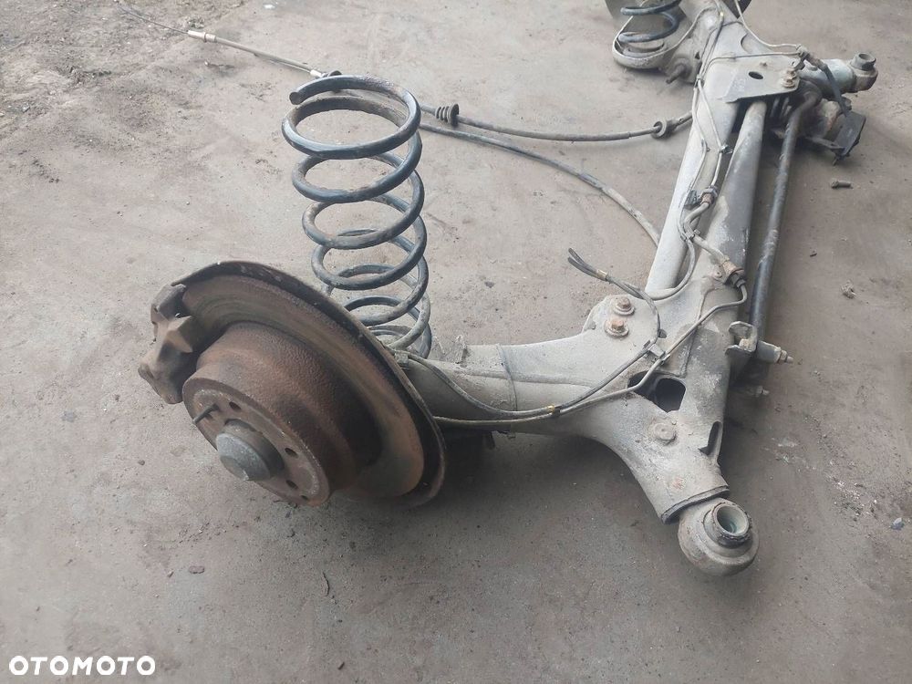 BELKA OŚ ZAWIESZENIA TYŁ TARCZE Z ABS VOLVO 850 I P9140143 - 2