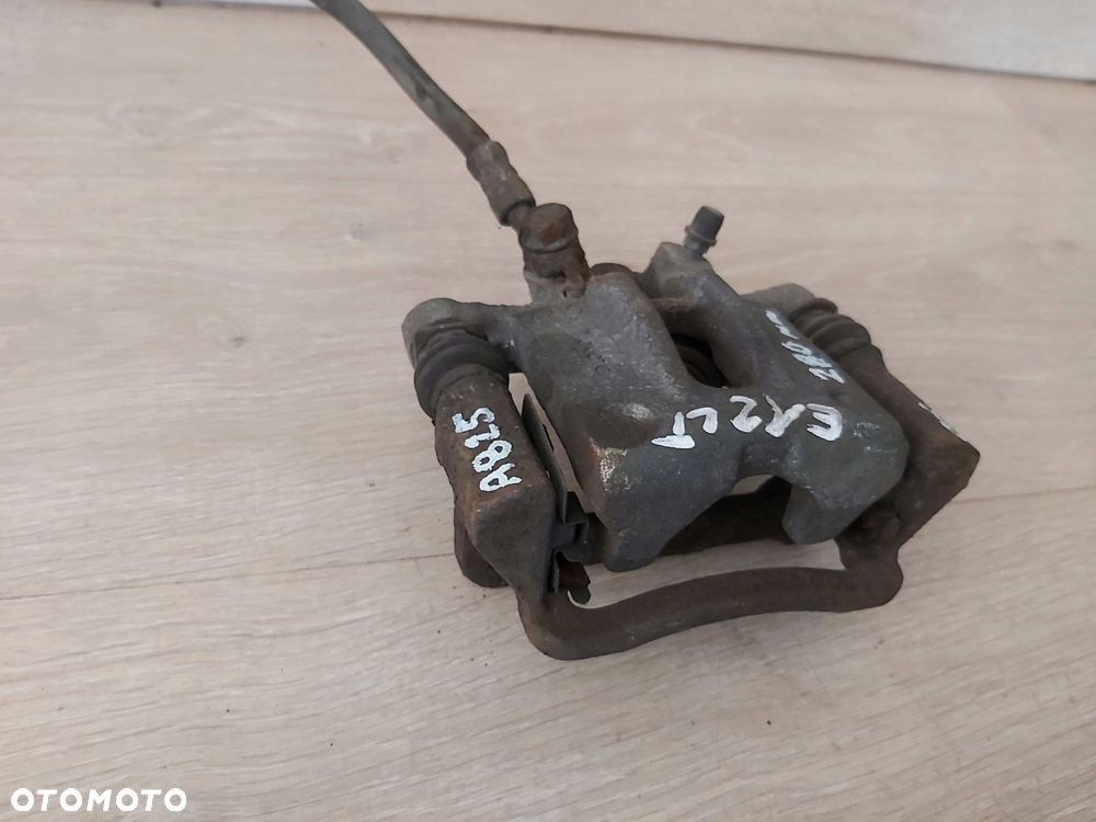 Toyota Corolla E12 zacisk jarzmo tył lewy TRW 275mm - 2