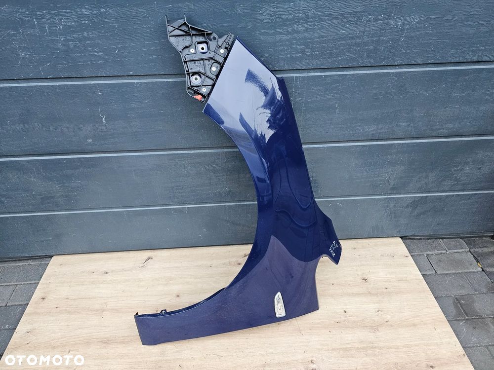 BŁOTNIK LEWY PRZÓD PRZEDNI OPEL ASTRA J Z20Z