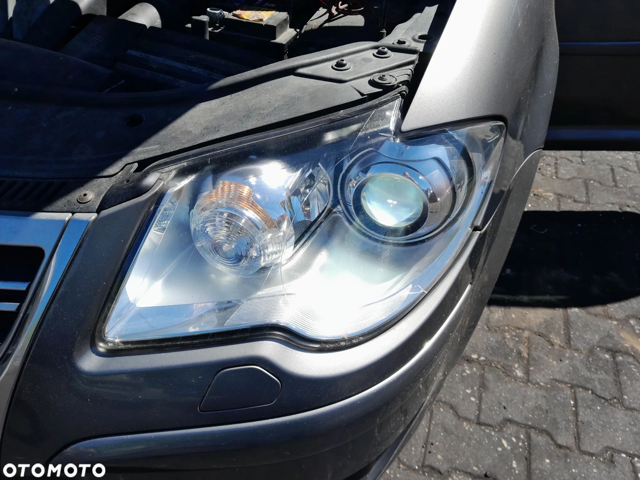Lampa przednia lewa xenon VW Touran I lift 06-10r. - 1