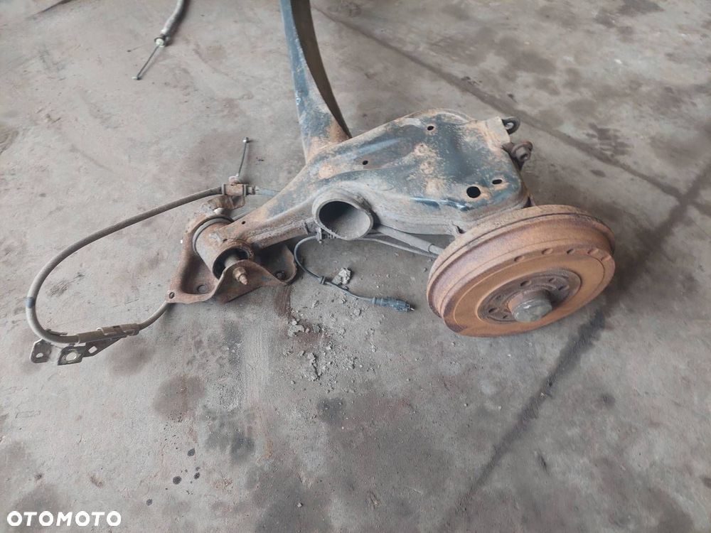 BELKA OŚ ZAWIESZENIA TYŁ BĘBNY Z ABS FIAT GRANDE PUNTO I - 2