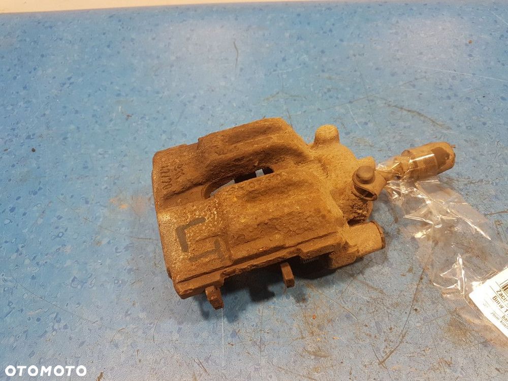 BMW 1 E87 118D ZACISK HAMULCOWY TYŁ LEWY N47