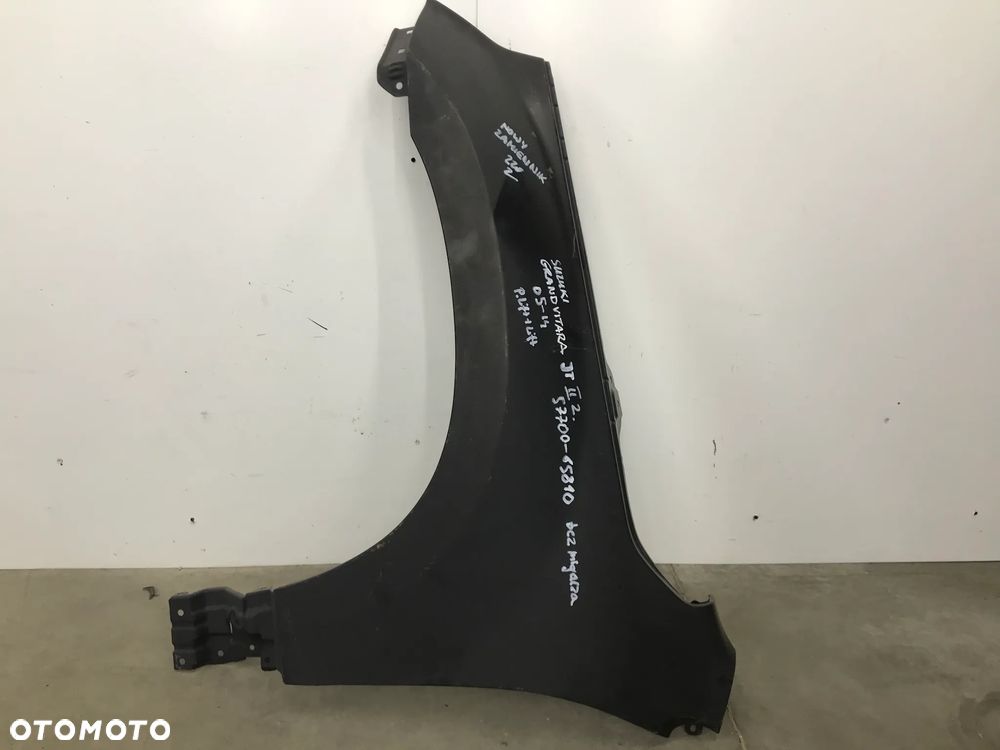 Błotnik Suzuki Grand Vitara 2 II 05-14r. lewy 57700-65810 - 1