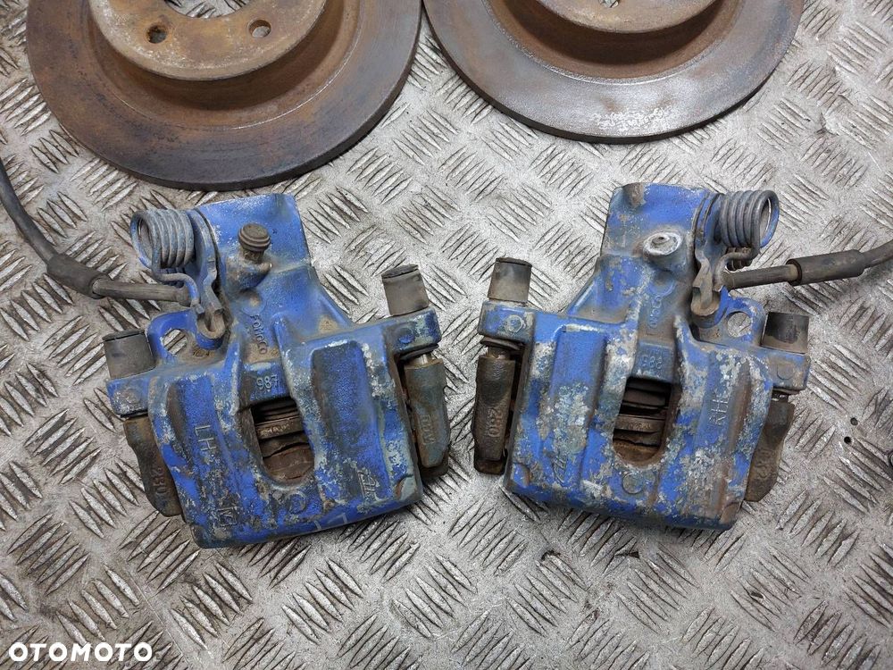 TARCZE HAMULCOWE TYŁ + KLOCKI + ZACISKI VOLVO S40 II V50 - 2