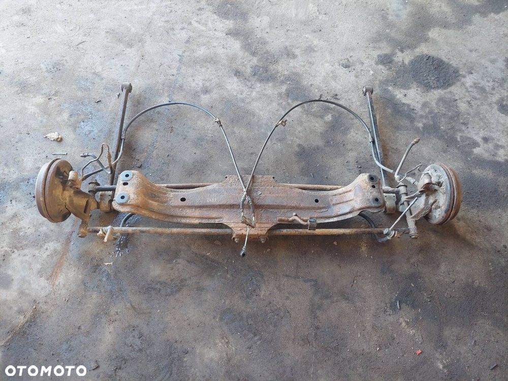 BELKA OŚ ZAWIESZENIA TYŁ MAZDA PROTEGE BJ 323 BJ - 1