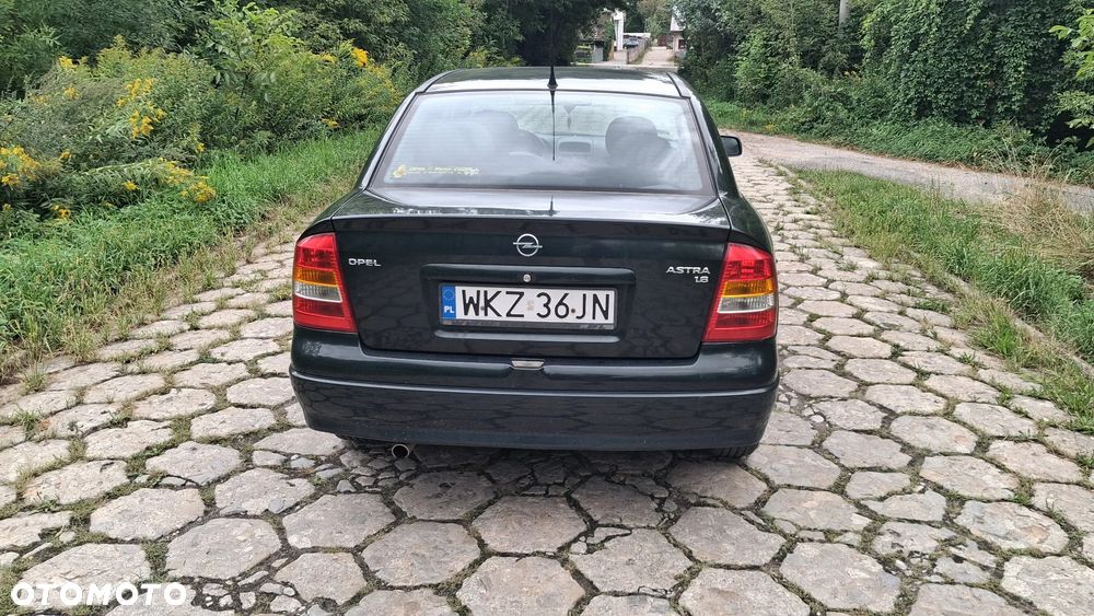 Na części Opel Astra G II SEDAN silnik 1.6 X16XEL Z16XE lakier Z380 skrzynia maska zderzak drzwi klapa szyba fotel kanapa lusterko lampa deska GWARANCJA !!! Przód Tył Zestaw Komplet Drzwi Klapa Zderzak Błotnik Maska Grill Atrapa Szyba Pas Lampa Lusterko Boczki Fotel Kanapa Kokpit Deska Rozdzielcza Przełącznik Włącznik Sterownik Przewody Wiązka Instalacja Moduł Komputer Czujnik Listwa Pompa Alternator Wtryski Głowica Rozrusznik Kompresor Sprzęgło Dwumas Silnik  Skrzynia ABS Klimatyzacji Paliwa Wspomagania Kolektor Turbina Przepustnica Zawór Chłodnica Koło Hak Belka Sanki Zawieszenie Mcpherson Półoś Amortyzator Wydech Tłumik Zacisk Most - 7