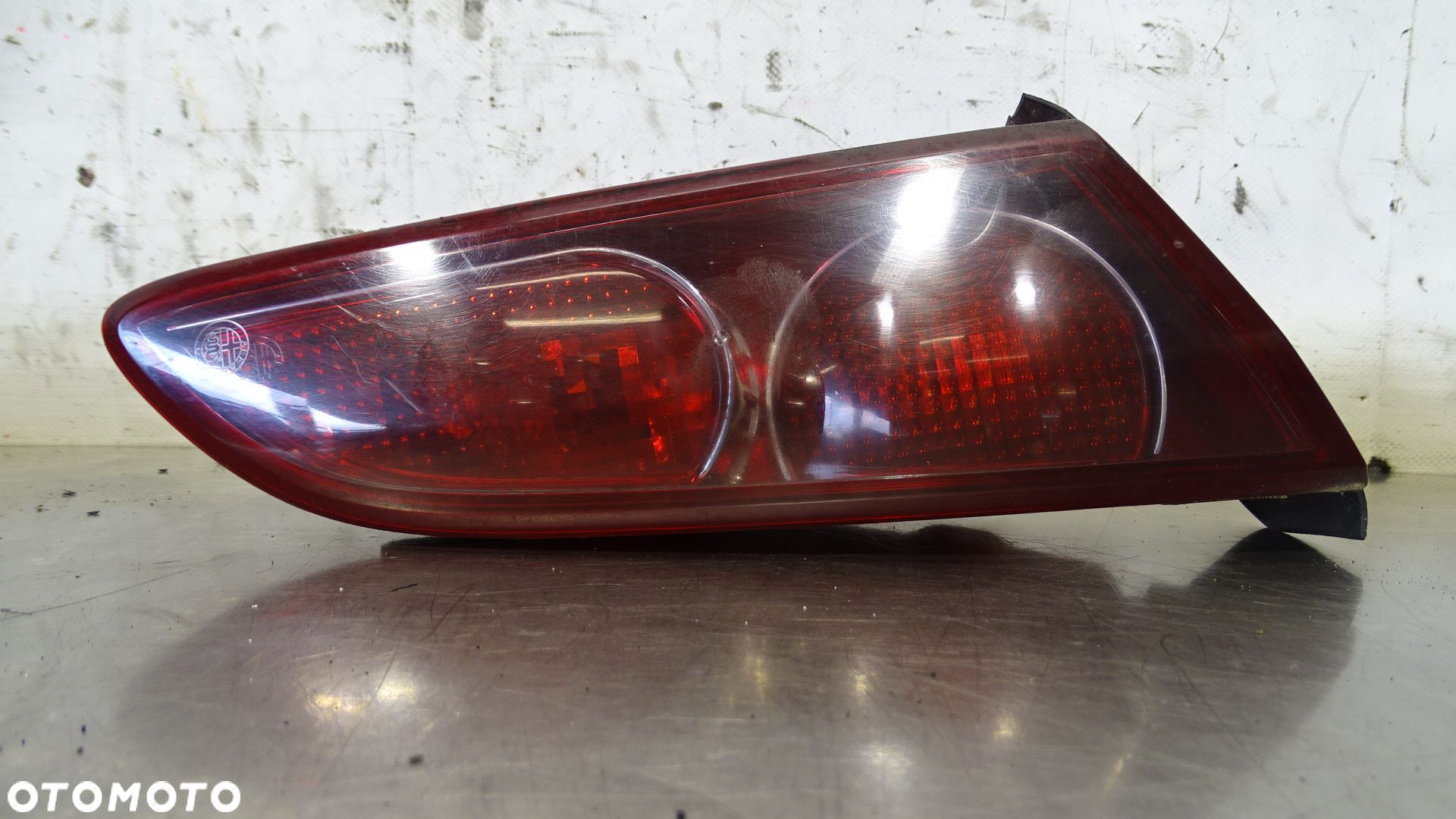 LAMPA LEWA TYLNA W KLAPIE ALFA ROMEO 159 JTDM 60691366 - 1