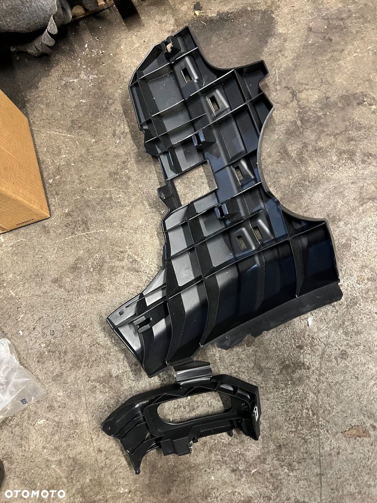 Mocowanie zderzaka przedniego lewe nowe Nissan Navara d40