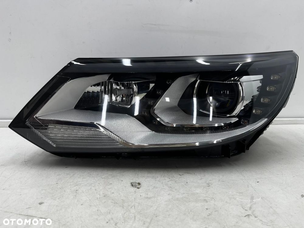 Lampa reflektor VW Tiguan 1 I 5n LIFT 10-16r. lewa przednia XENON EU skrętna doświetlanie zakrętów + - 1