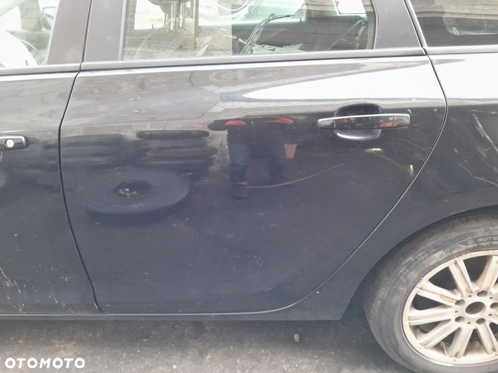 Drzwi tylne lewe OPEL Astra J kombi 09-19r. Z22C - 2