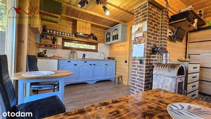 Atrakcyjny dom drewniany całoroczny na dużej dział-7