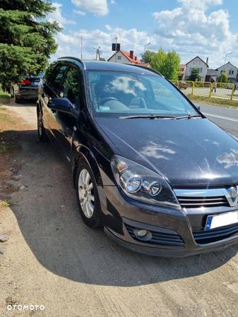 Opel Astra H kombi 2006r 1.6 16v Z16XEP Black Sapphire kod lakieru 2HU na czesci - 2