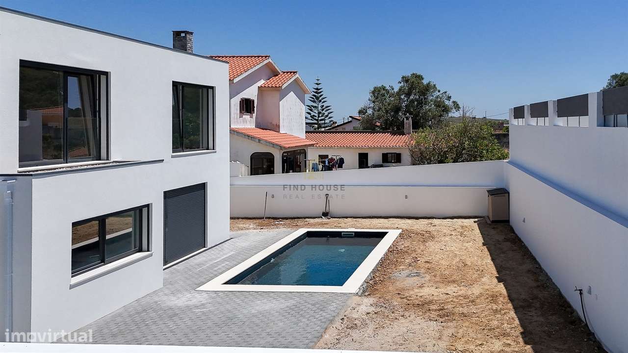 Vende-se Moradia Isolada T4 com garagem, piscina e jardim em Albarraqu-48
