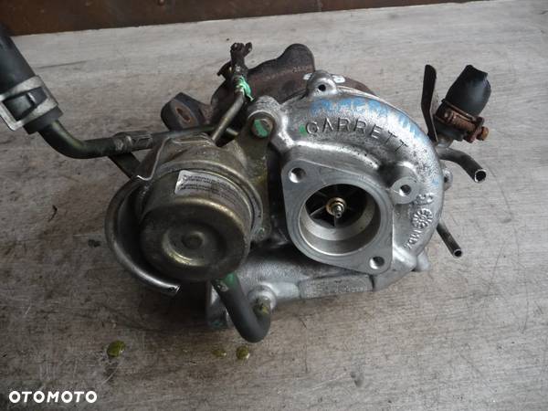 STAN BDB NISSAN ALMERA N16 ALMERA TINO 2.2TD TURBINA TURBOSPRĘŻARKA 144114U110 - 1