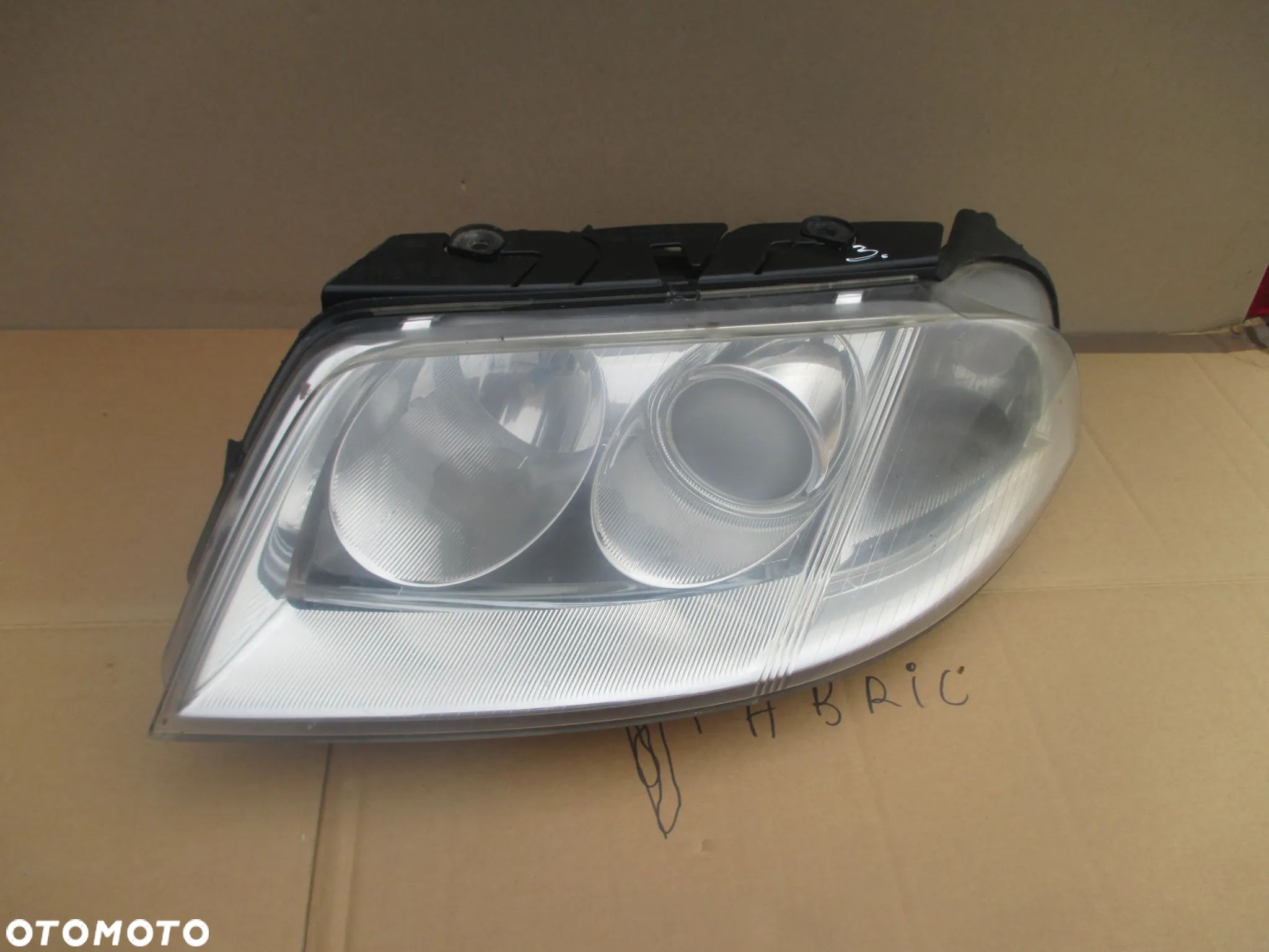 lampa lewa VW Passat B5 lift Hella Europa - 1