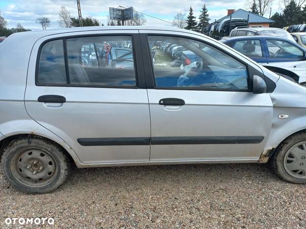 Hyundai Getz 1.1 04r drzwi prawe przednie  kompletne - 1