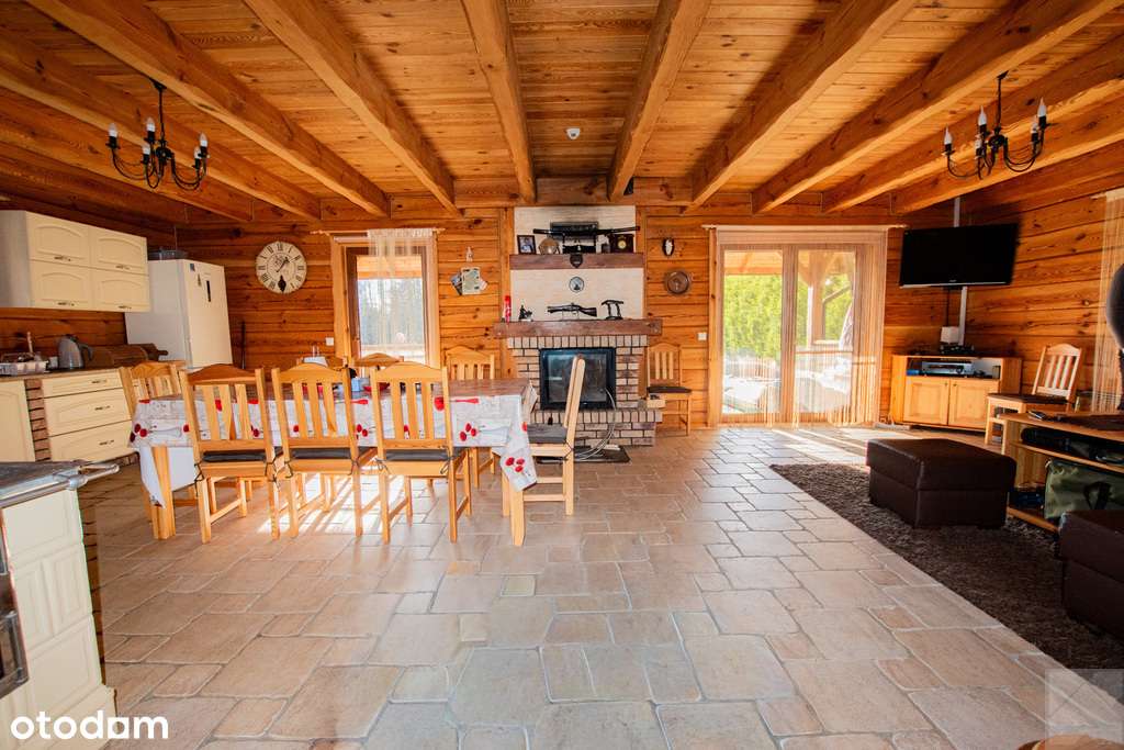 Dom z pełnego bala z zarybionym stawem-8