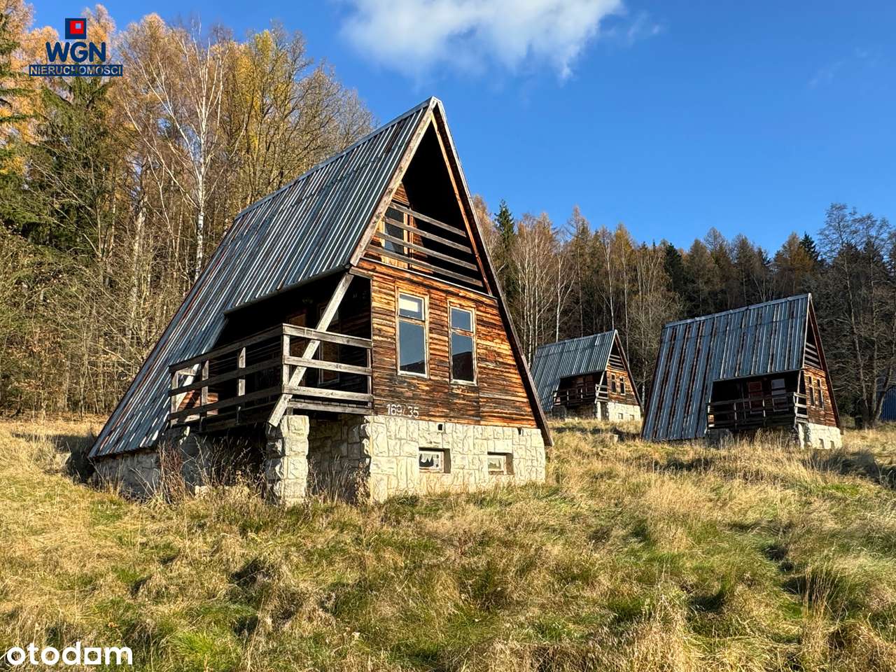 Grunt zabudowany 10-ma domkami nad jeziorem - na sprzedaż.-14