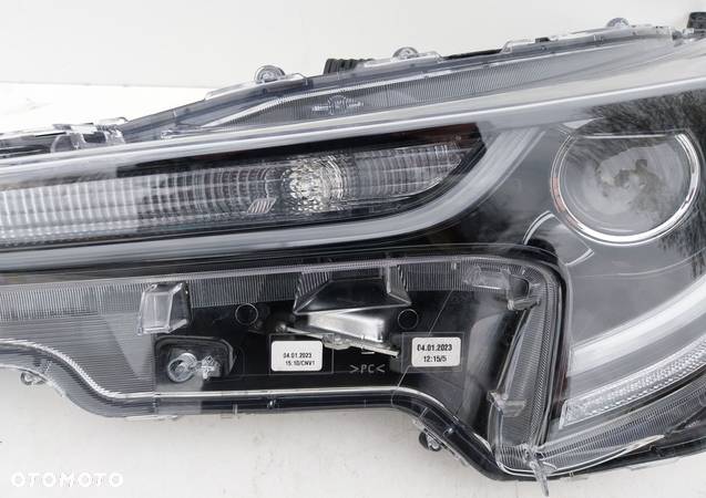 Lampa przód lewa Toyota Corolla E21 81170-02S70 - 5