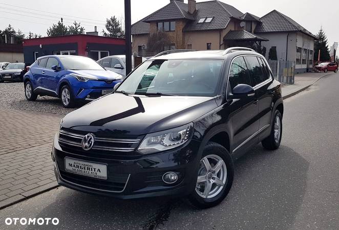 Volkswagen Tiguan 1.4 TSI 4Motion Exclusive - 1