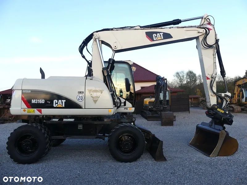 Caterpillar CAT M316D z Niemiec / 12.700mtg / - 1