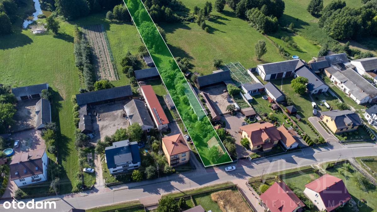 Siedlisko z domem drewnianym i bud. gospodarczym