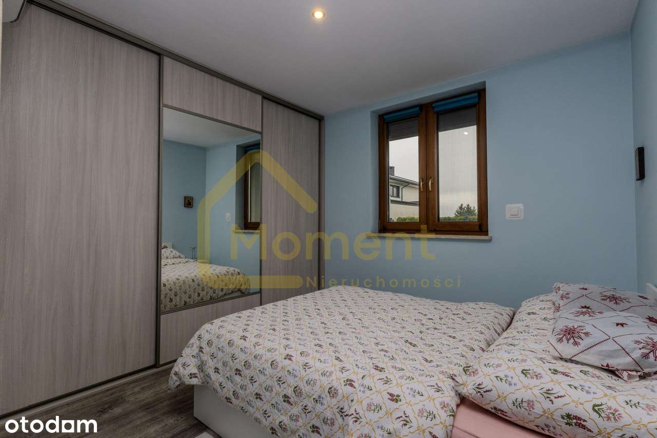 Ekonomiczny dom z garażem i pięknym ogrodem-11