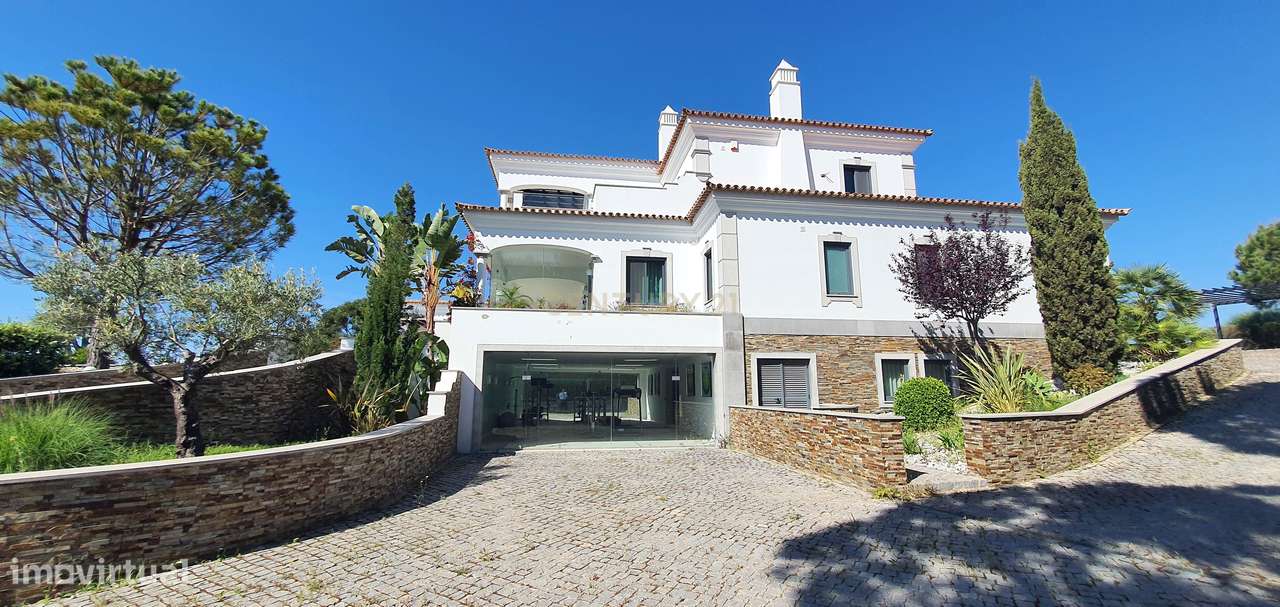 Exclusiva e luxuosa moradia T5 num dos mais prestigiados campos de gol - Grande imagem: 2/48