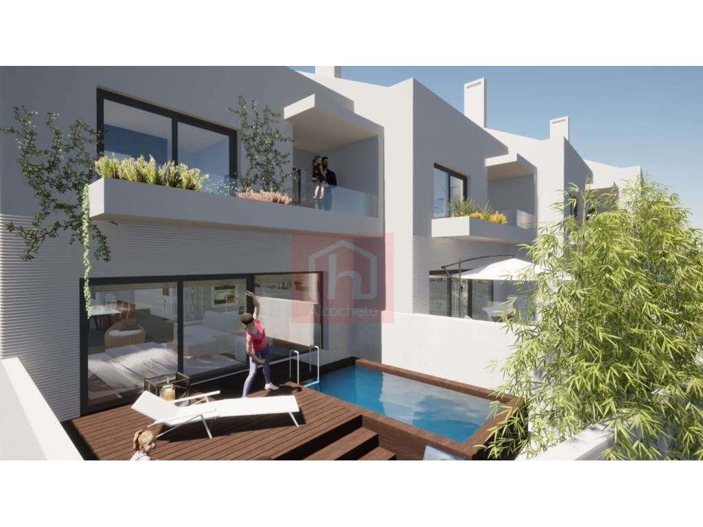 Moradia em banda T3+1 com piscina em Sarilhos Grandes.-1
