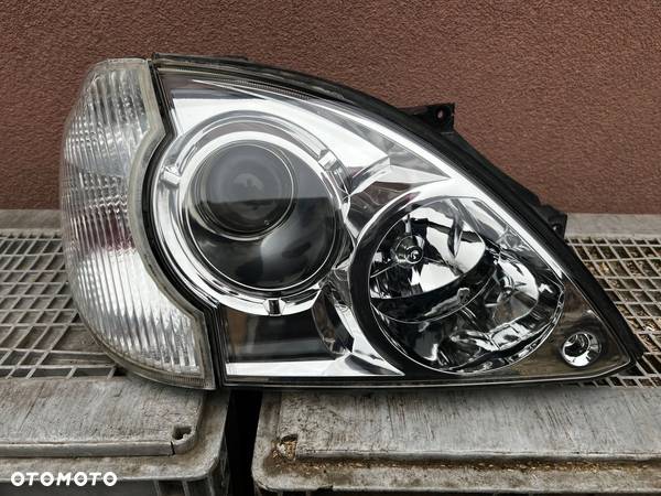 Lampa przednia HYUNDAI TERRACAN PRAWA EUROPA ORYGINALNA - 1