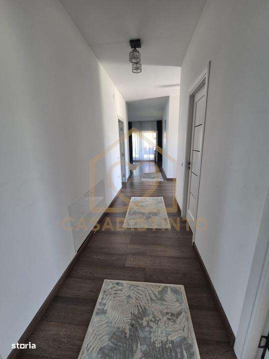 Casa pe nivel cu garaj si 6 ari teren in Sasar - Imagine principală: 5/12