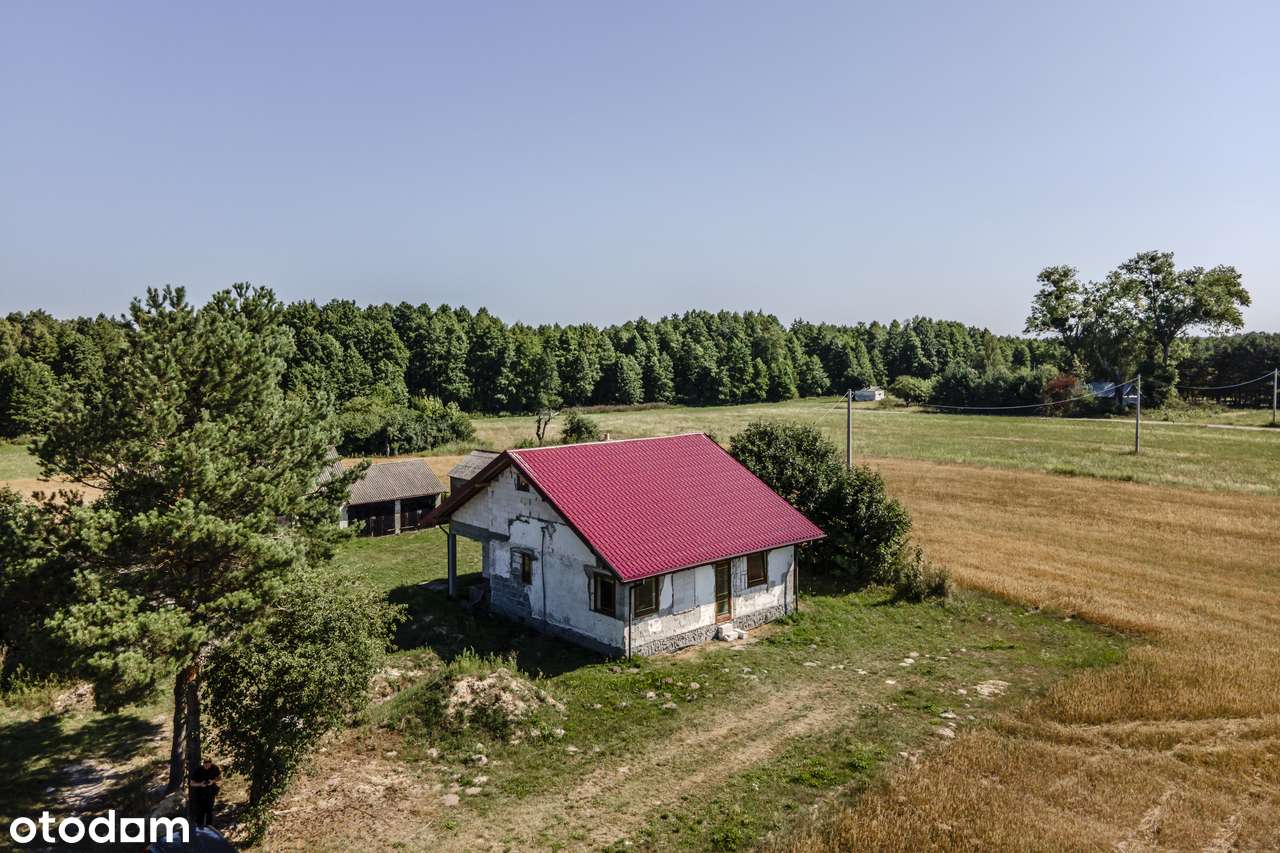 Siedlisko na wsi 1,8ha z domem 90m2 do wykończenia + budynki gosp