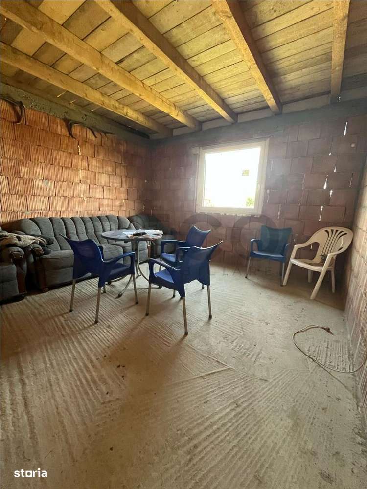 RECO Casa la rosu, la iesire din Les, langa padure - Imagine principală: 5/12