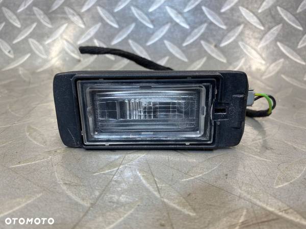 LAMPKA TABLICY REJESTRACYJNEJ OPEL ASTRA IV J KOMBI ORYGINAŁ 13578958 - 1