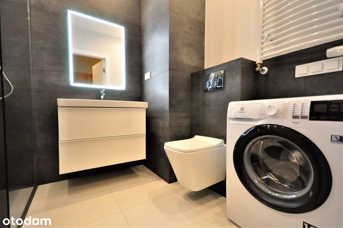 Kawalerka z sypialnią, balkonem i garażem.-8