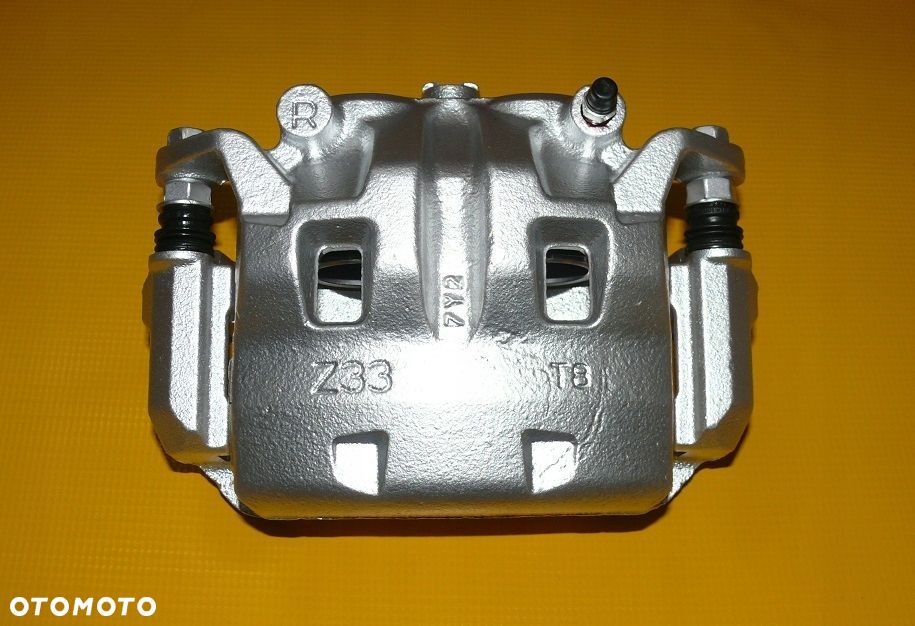 ZACISK HAMULCOWY JARZMO PRAWY PRZÓD NISSAN PATHFINDER III 3 R51 296/28mm 4- - 1