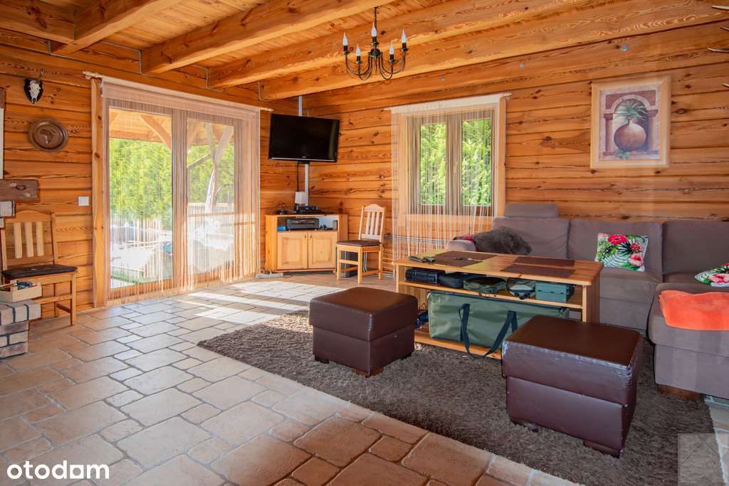 Dom z pełnego bala z zarybionym stawem-10