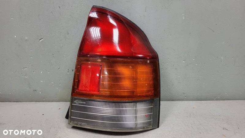 Lampa Prawy Tył Stanley Mazda 323P 94-98 - 1